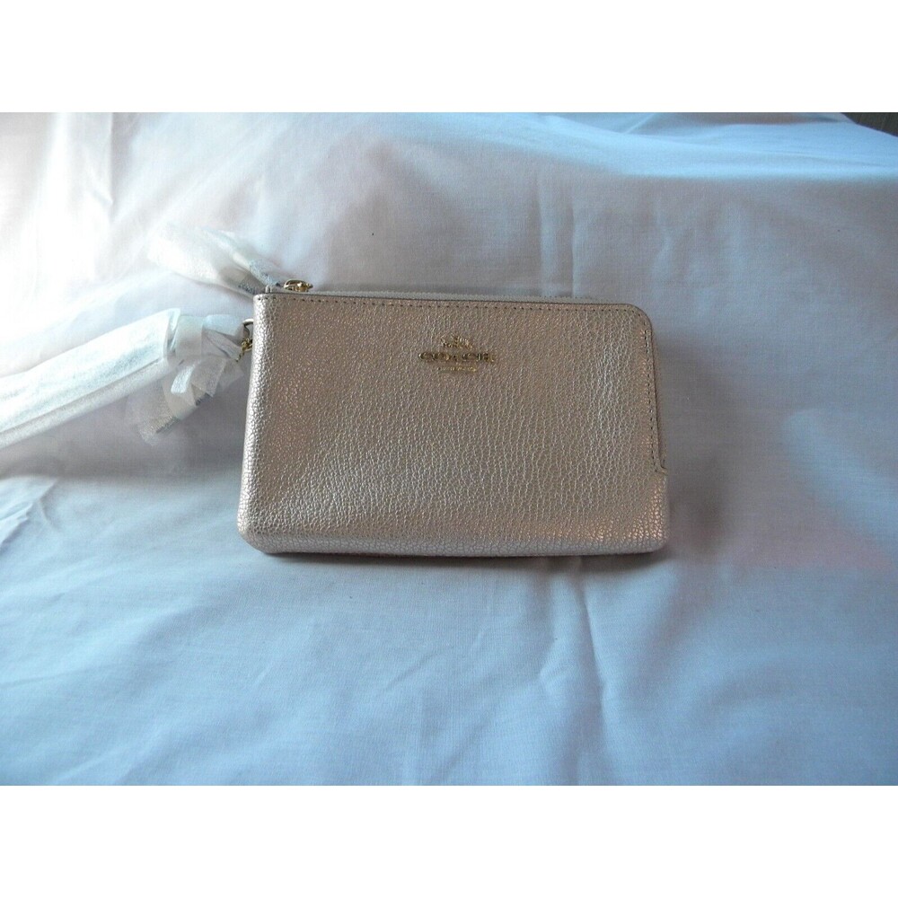 Coach gold pebbled leather double zipper wallet partially wrapped Never used.